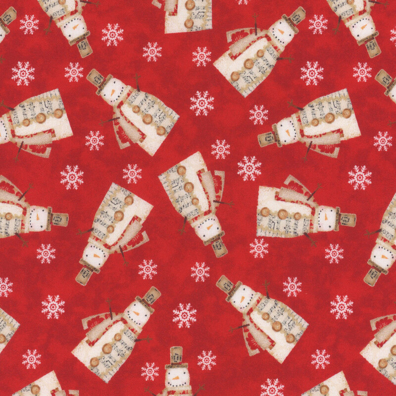 fabric featuring snowmen and snowflakes on a bold red background