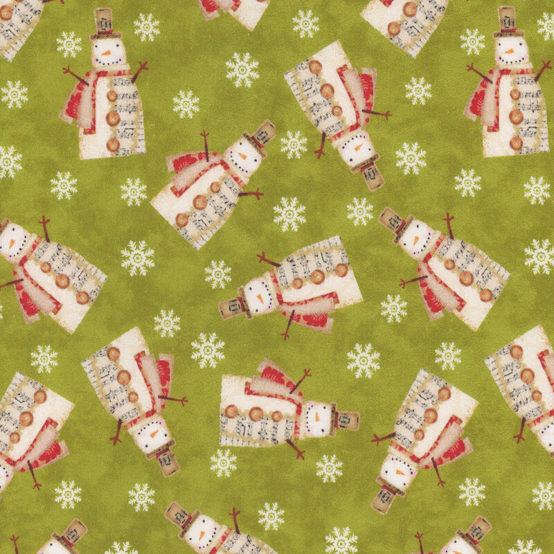 fabric featuring snowmen and snowflakes on a green background