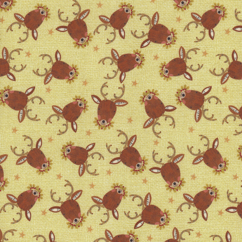 fabric featuring reindeer on a green background