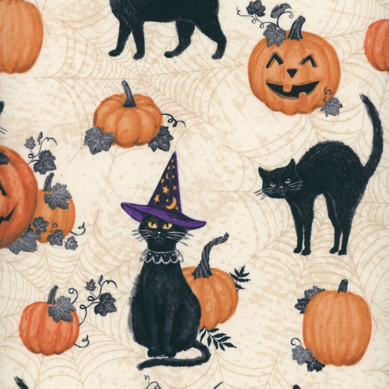 cream fabric featuring black cats, pumpkins, and jack o'lanterns
