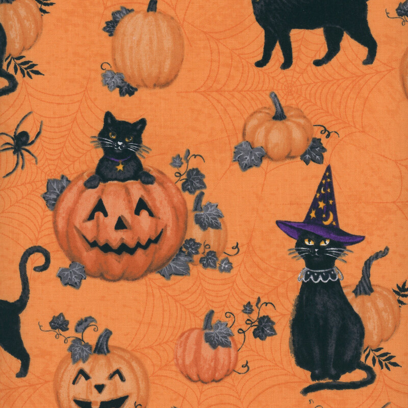 orange fabric featuring black cats, pumpkins, and jack o'lanterns