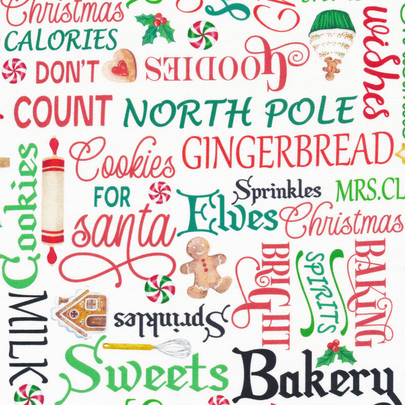 White fabric with holiday phrases and baking paraphernalia.