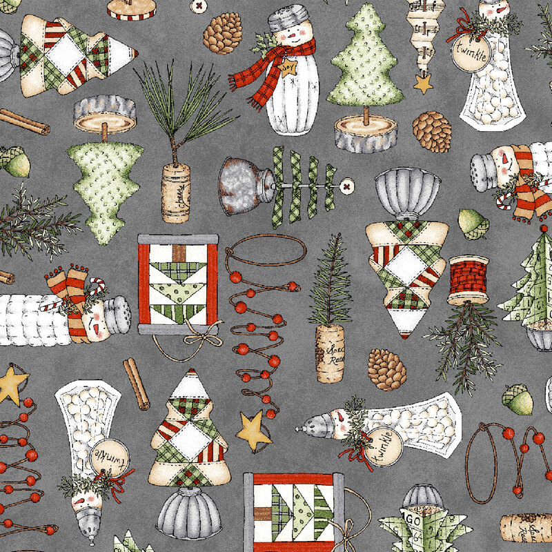 lovely textured gray fabric, with scattered homemade ornaments and decorations, including salt shaker snowmen, wine cork pine trees, and different variations of fabric Christmas trees