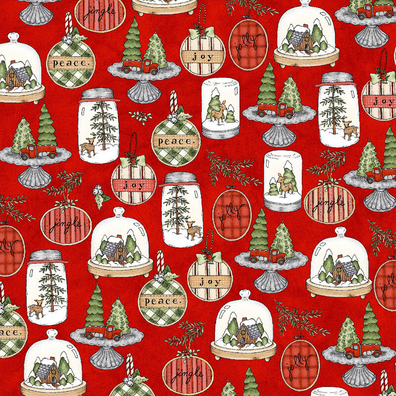 lovely textured red fabric, with various Christmas decorations and ornaments, including cloche winter cabins, mason jar snow globes, and embroidery hoop ornaments