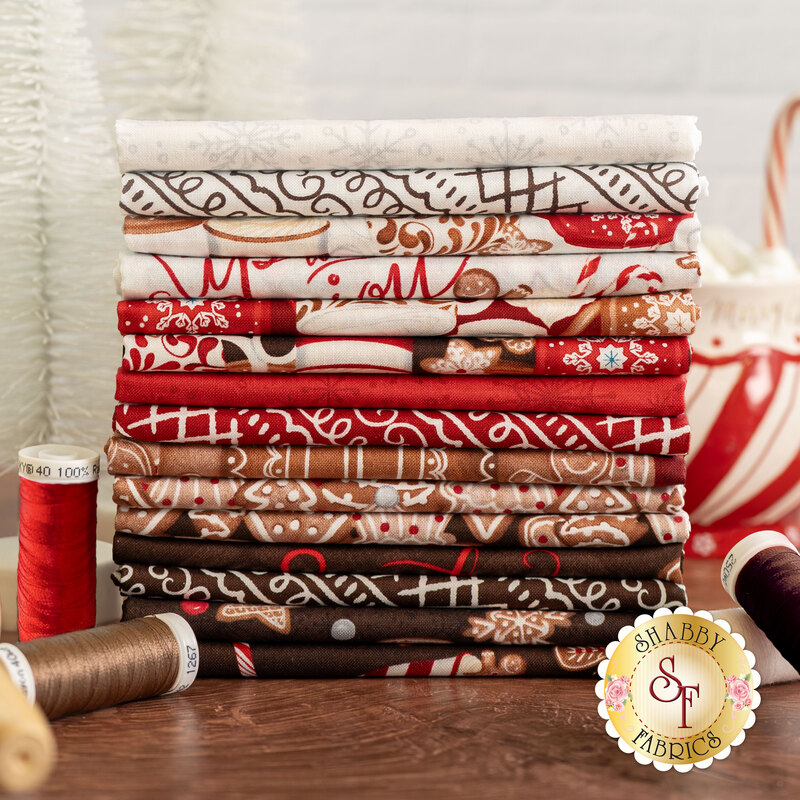 Styled photography of fabrics in baking up joy featuring, cookies, hot cocoa and baking supplies in red, brown, and white 