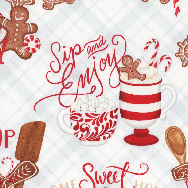 white fabric featuring gingerbread houses, cookies, hot cocoa and cozy phrases