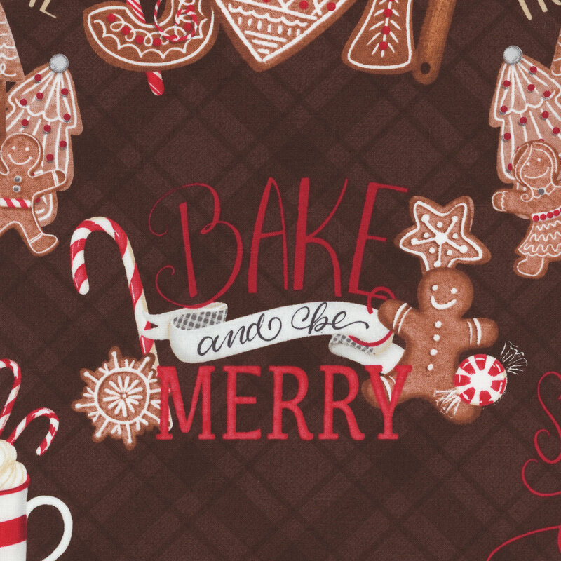 brown fabric featuring gingerbread houses, cookies, hot cocoa and cozy phrases