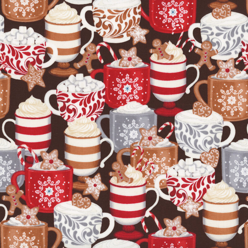 fabric featuring gingerbread cookies, and hot cocoa with whip cream on a brown background