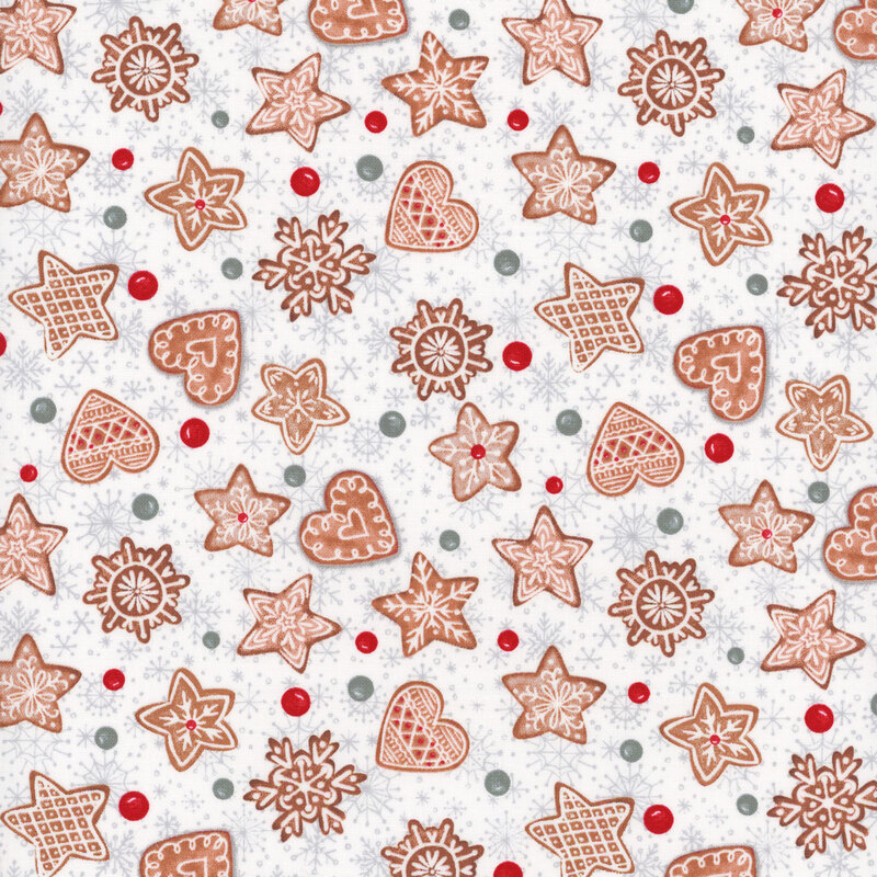 white fabric featuring decorated gingerbread cookies