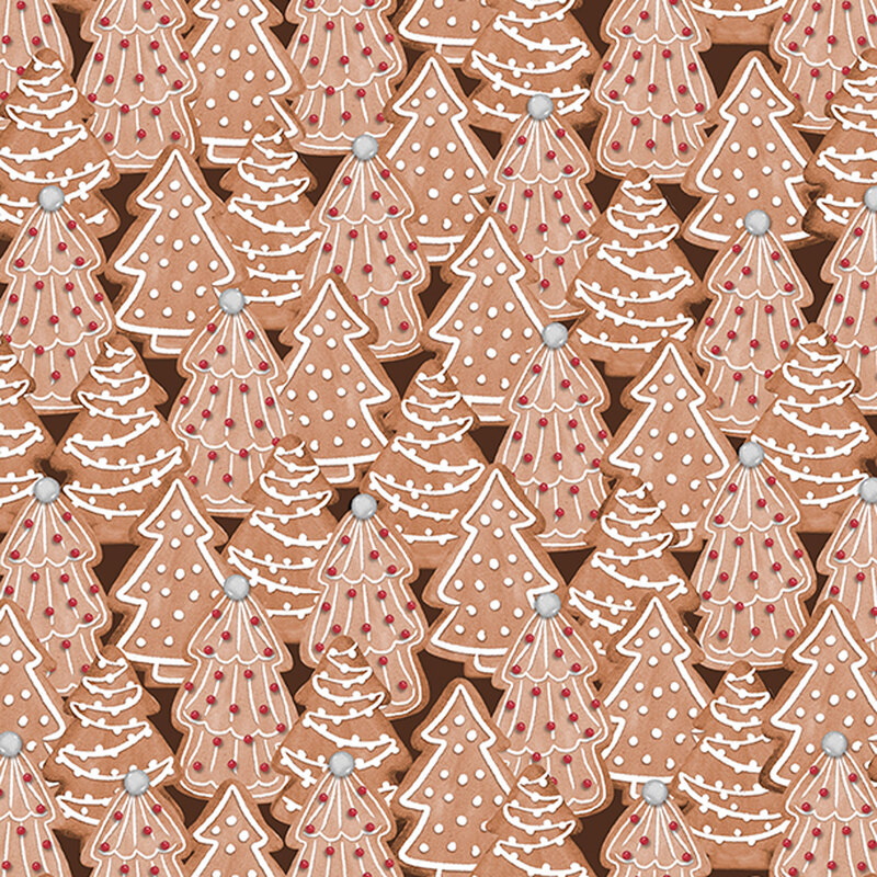 fabric featuring decorated Christmas tree cookies on a brown background