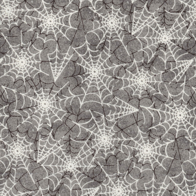 speckled gray fabric, featuring interwoven spiderwebs in white and black