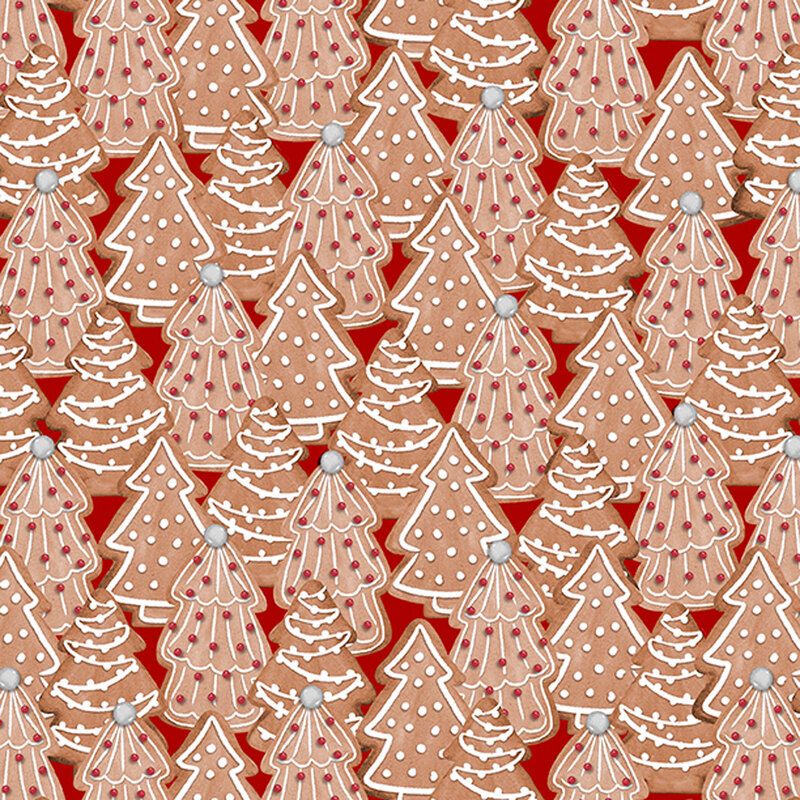 fabric featuring decorated Christmas tree cookies on a red background