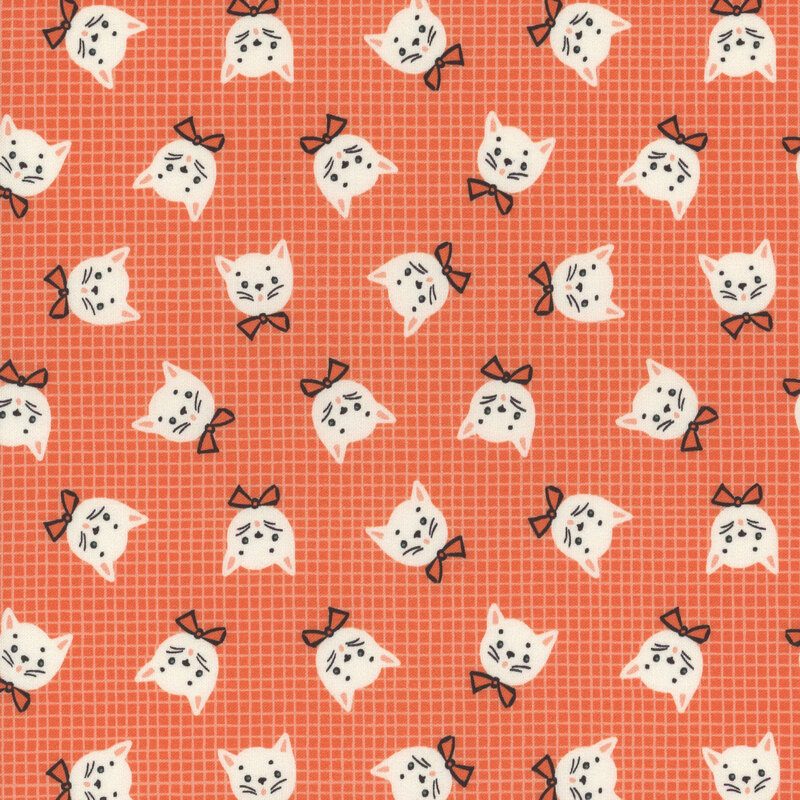 Orange fabric with thin white grid lines in the background and tossed white cat heads wearing bow ties