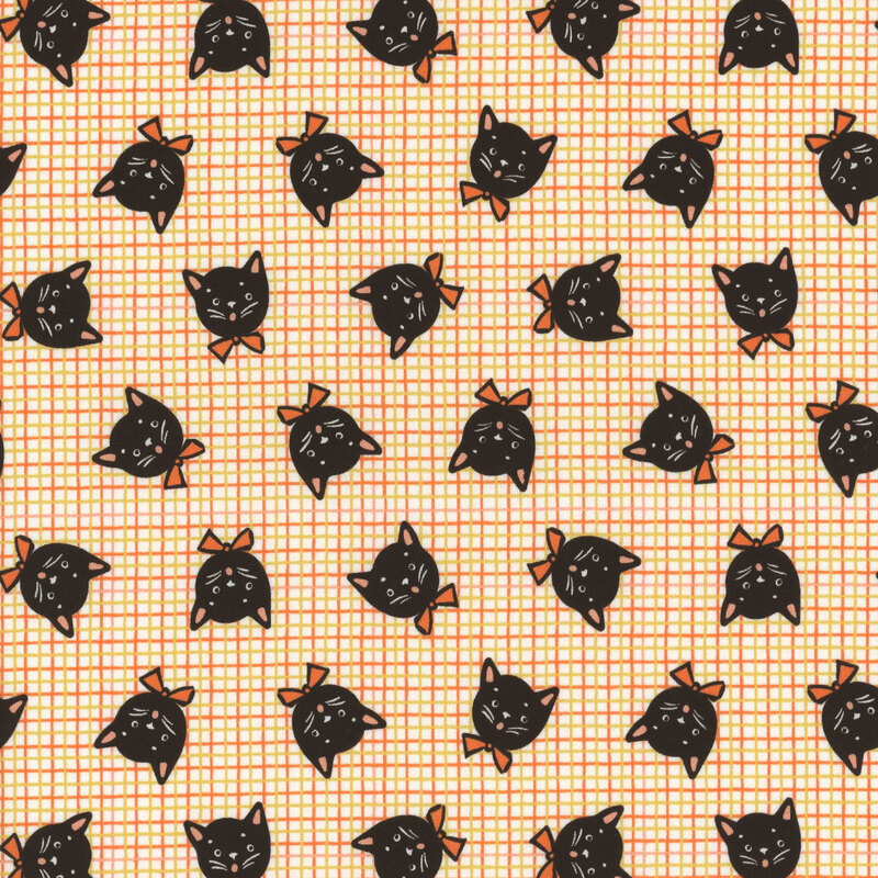 Cream fabric with thin orange and yellow grid lines in the background and tossed black cat heads wearing bow ties