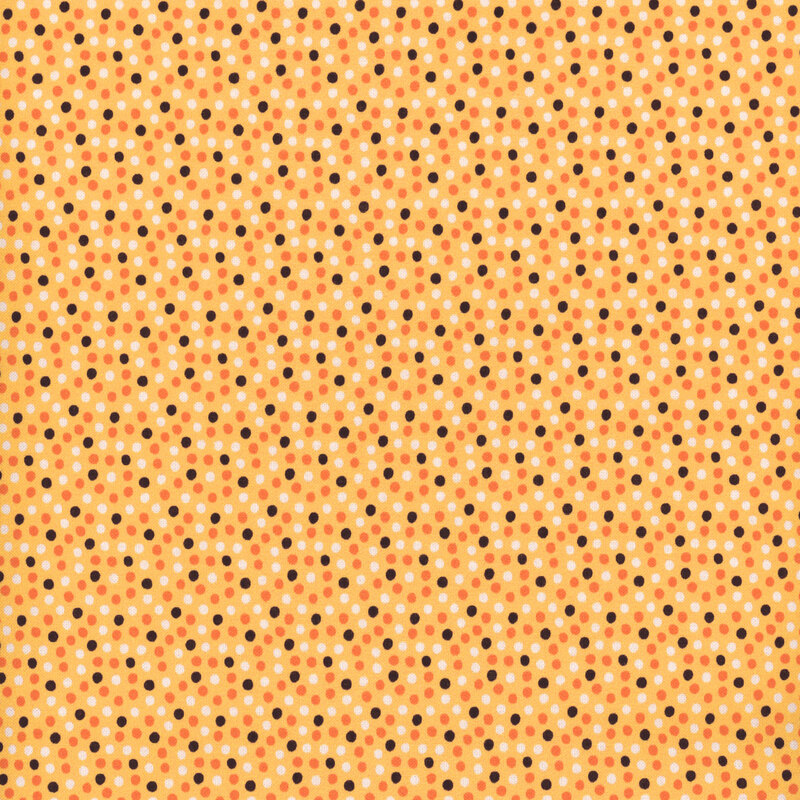 Light yellow fabric with tiny dots close together in white, orange, and black