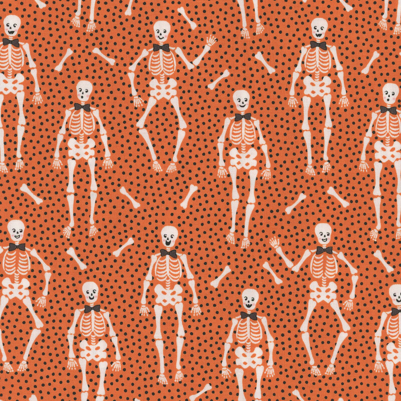 Orange fabric with tiny black dots close together and upright bow tie wearing skeletons with long bones tossed between them.