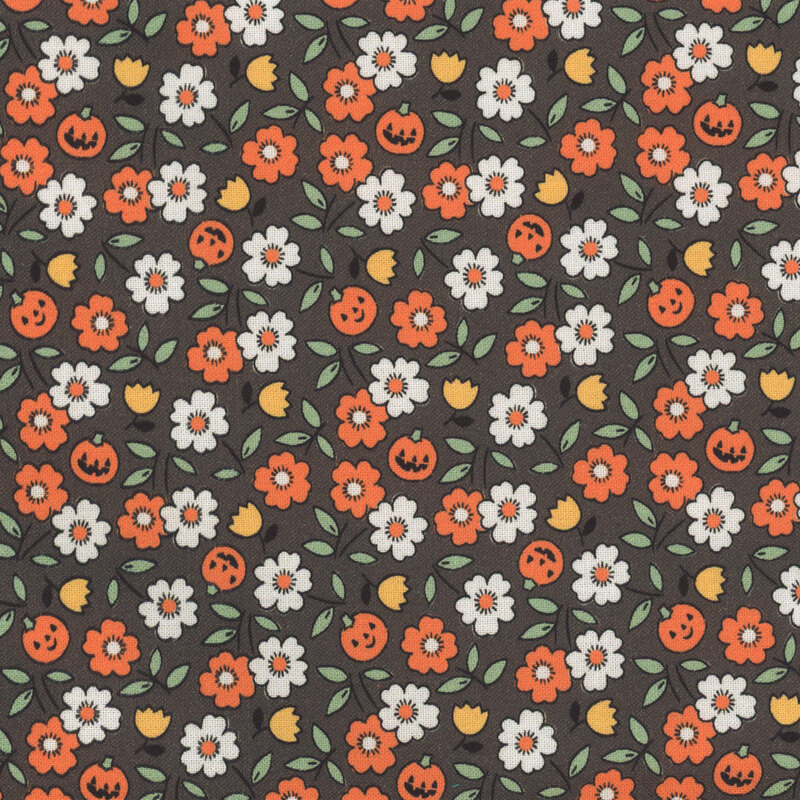 Dark gray fabric featuring tossed white, orange, and yellow flowers amid small jack-o-lanterns