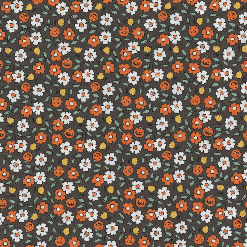 Dark gray fabric featuring tossed white, orange, and yellow flowers amid small jack-o-lanterns