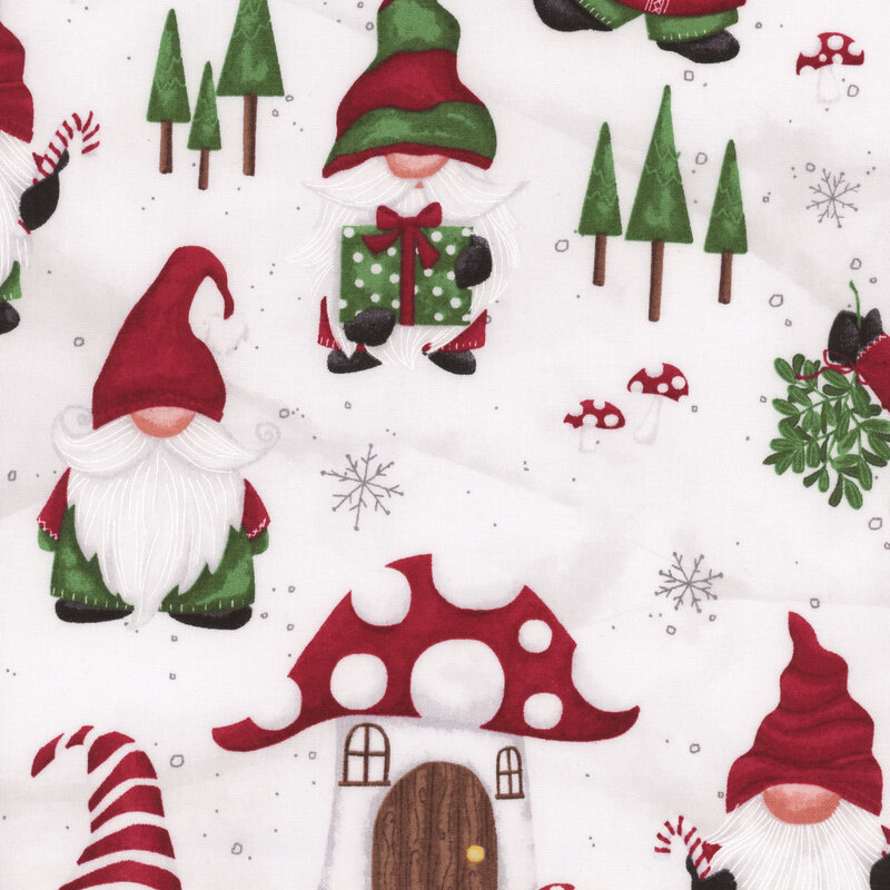 White fabric with a pattern of gnomes and mushroom houses in the snow.