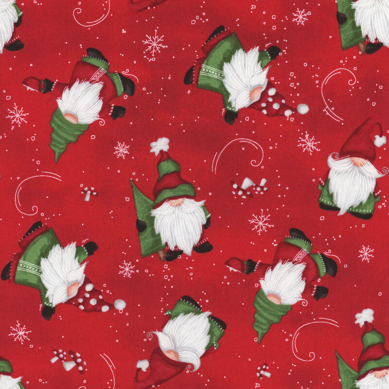 Red fabric with a festive tossed gnomes pattern.