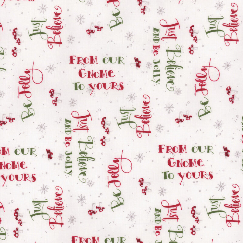 White fabric with festive phrases, snowflakes, and mushrooms.
