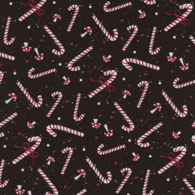 Black fabric with mushrooms and candy canes.