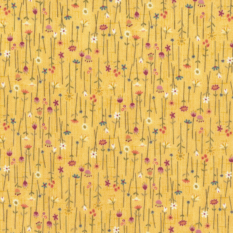 Yellow fabric covered in vertical long-stemmed wild flowers