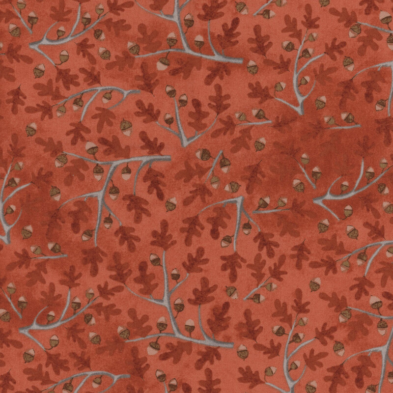 brick red fabric with scattered oak branches with dark orange leaves and acorns