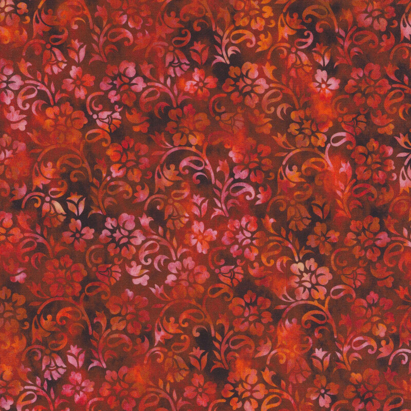 red and orange mottled fabric featuring a floral design
