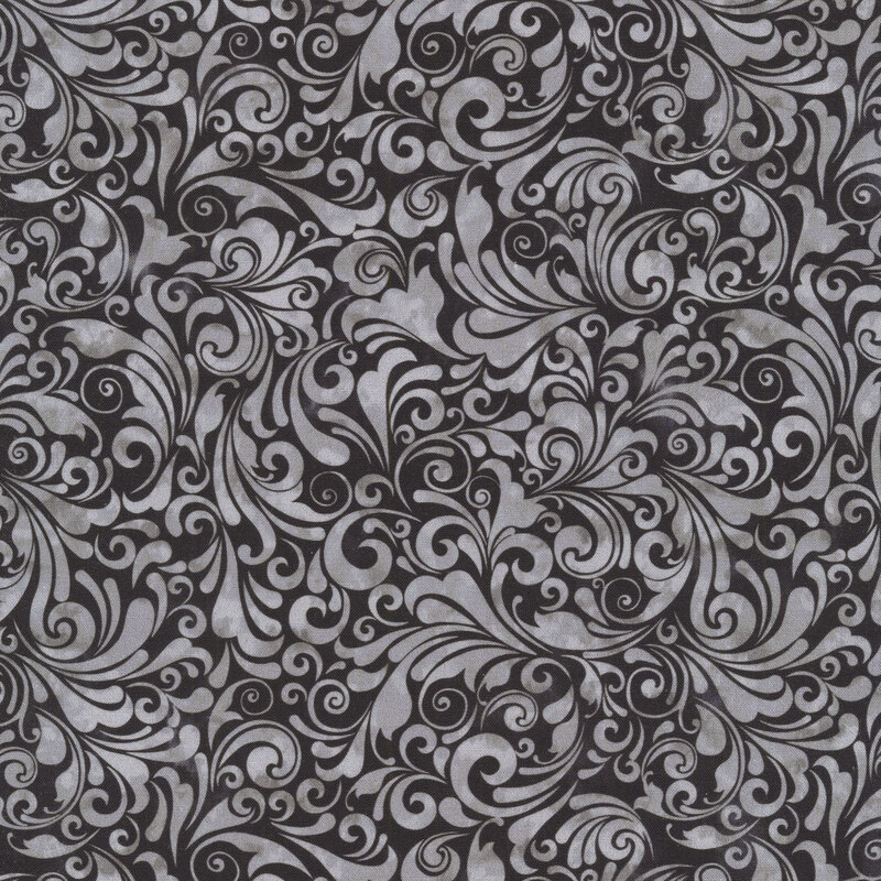 black and gray mottled fabric featuring a swirled design