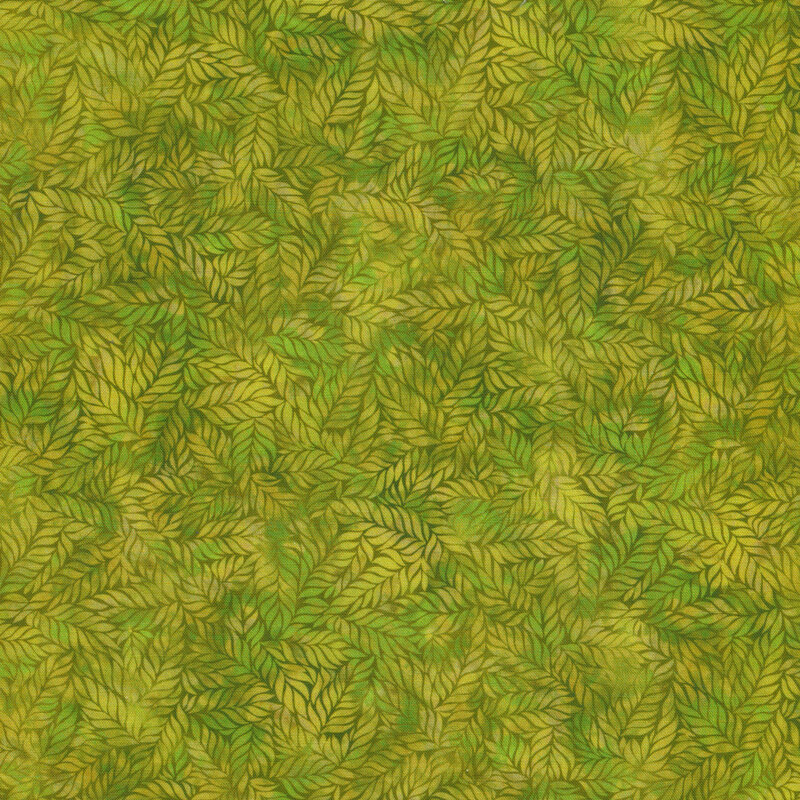yellow-green mottled fabric featuring leaves with hints of vibrant green