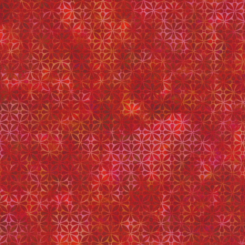 light and dark red mottled fabric featuring a geometric design with hints of gold