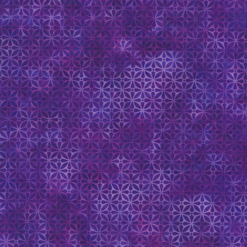 light and dark purple mottled fabric featuring a geometric design with hints of dark blue