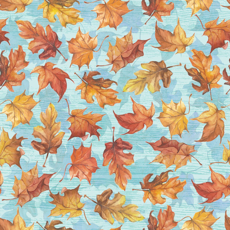 Aqua fabric with a falling leaves pattern.