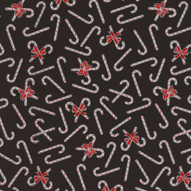 Black fabric featuring tossed candy canes 
