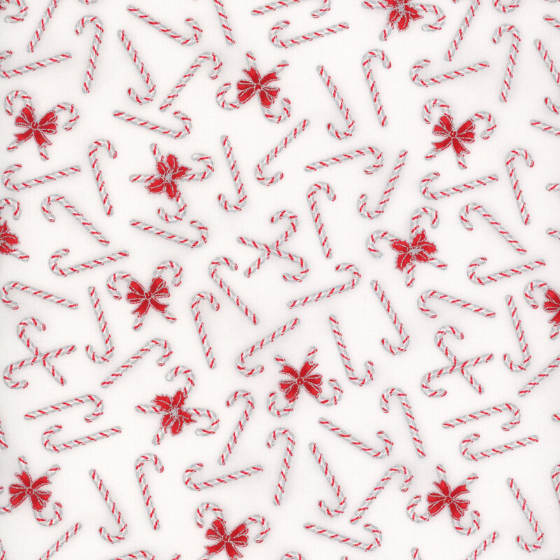 white fabric featuring tossed candy canes 