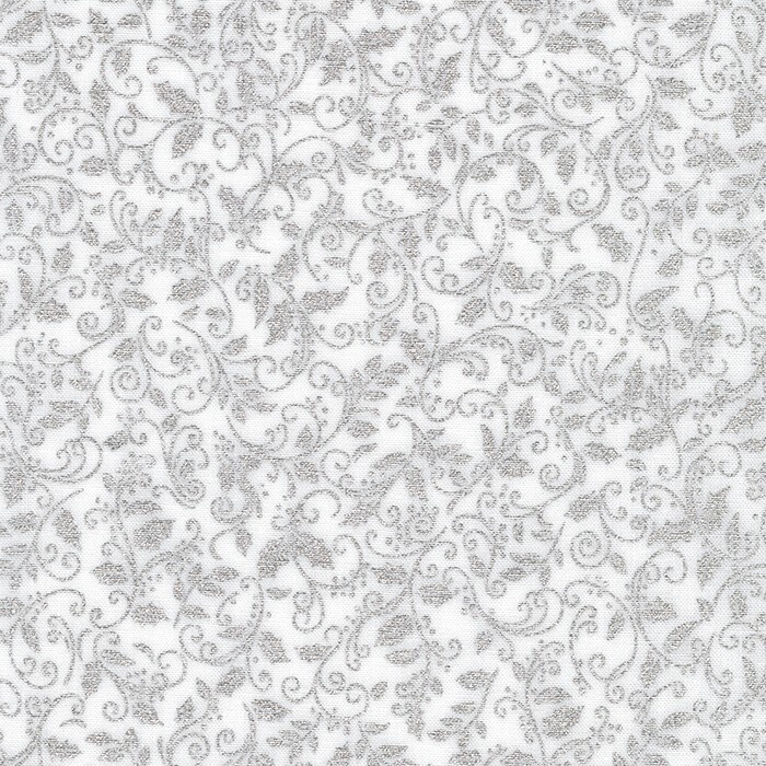 white fabric featuring metallic silver leaves and vines