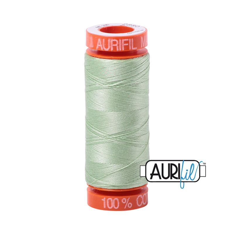 Pale Green thread on an orange spool, isolated on a white background