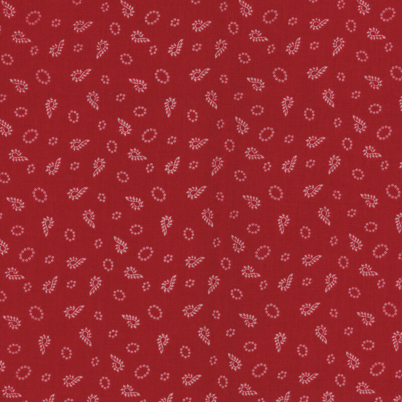 Tonal red fabric with a tossed candy cane pattern