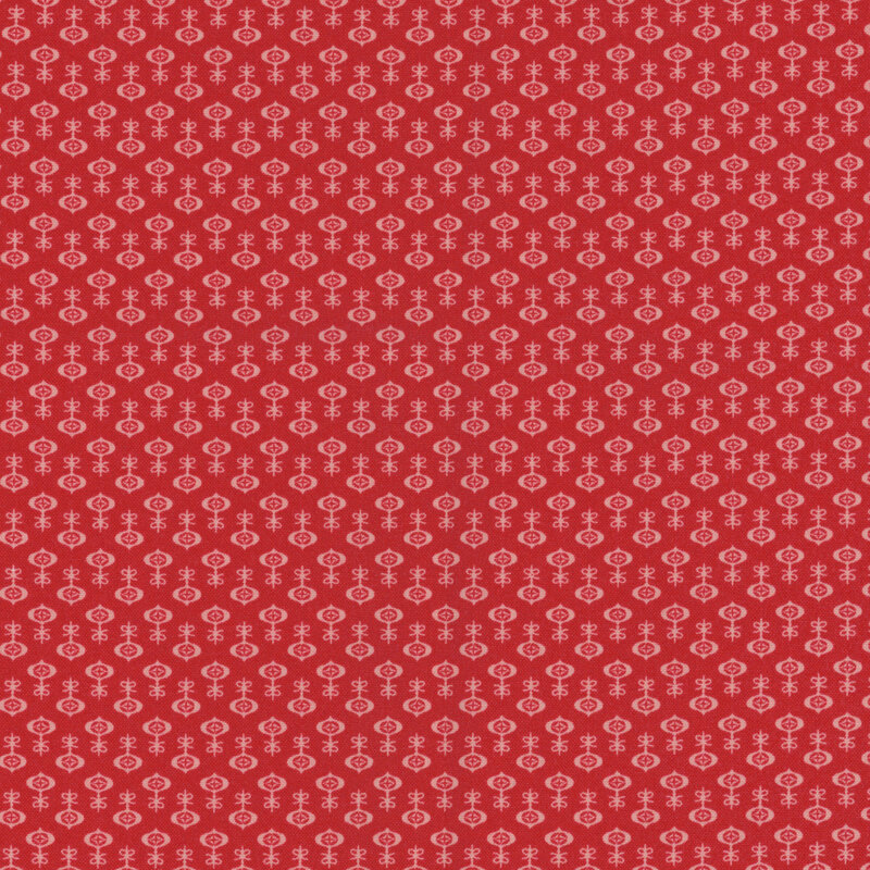 Berry red fabric with a tonal ornament pattern