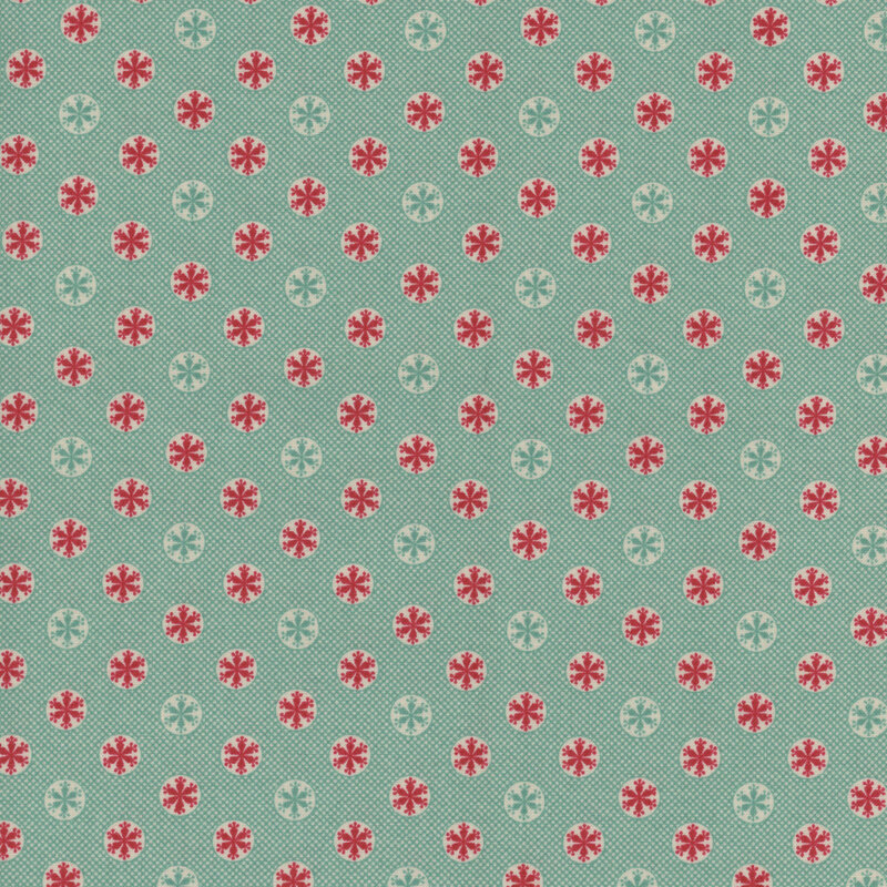 Teal fabric with a snowflake pattern