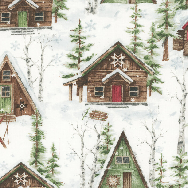 Fabric featuring winter lodges with snow, and trees