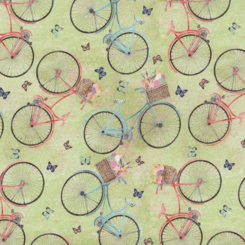 Green fabric with butterflies and bicycles with Easter egg filled baskets.
