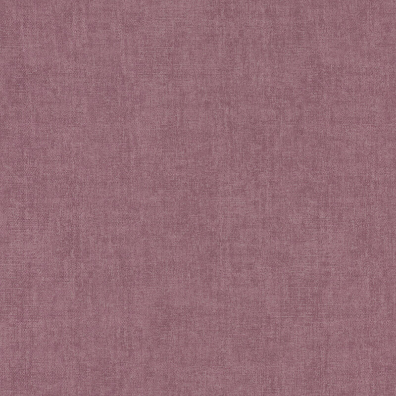 Solid tonal mauve fabric with light texturing all over