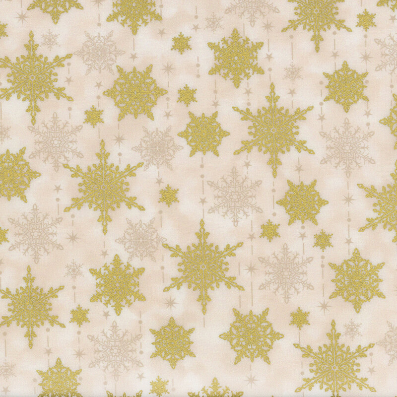 gorgeous cream mottled fabric with scattered tonal and metallic gold snowflakes with tonal dots, stars, and dashes mimicking the falling of snow