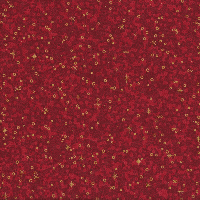 lovely red fabric with a packed together design of tonal and metallic gold circles, accented with scattered metallic gold stars