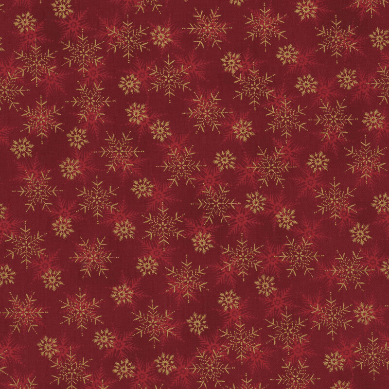 beautiful red fabric with scattered tonal and metallic gold snowflakes