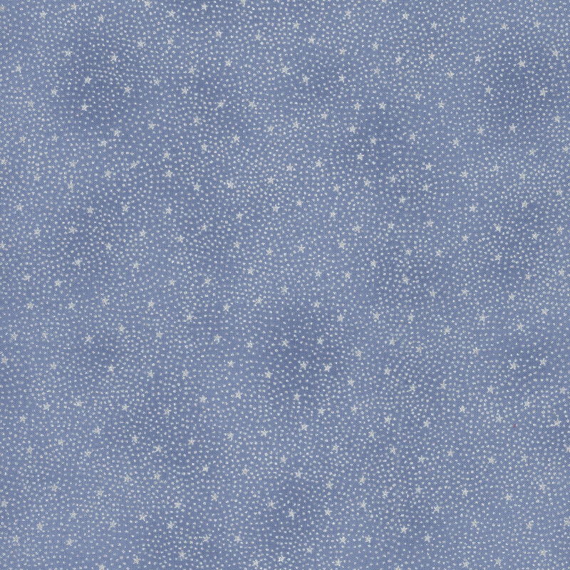 gorgeous denim blue fabric with tiny scattered metallic silver stars surrounded by pin dots in a radiating pattern