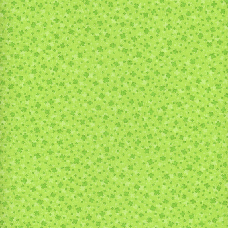 Scan of bright green fabric with a repeating and tossed cross motif