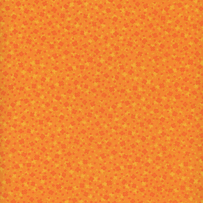Scan of bright orange fabric with a repeating and tossed cross motif